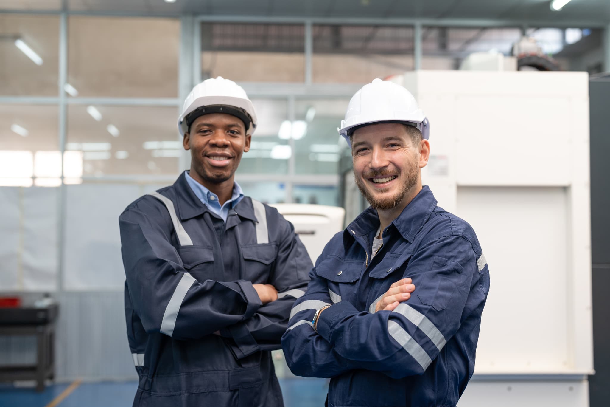 Industrial control systems engineers on a manufacturing floor